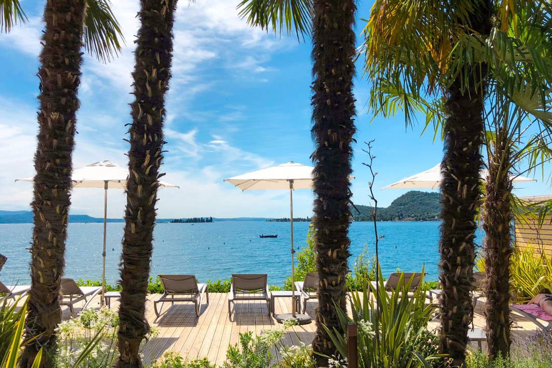 How far from the lake is Concept Village Piccola Gardiola?