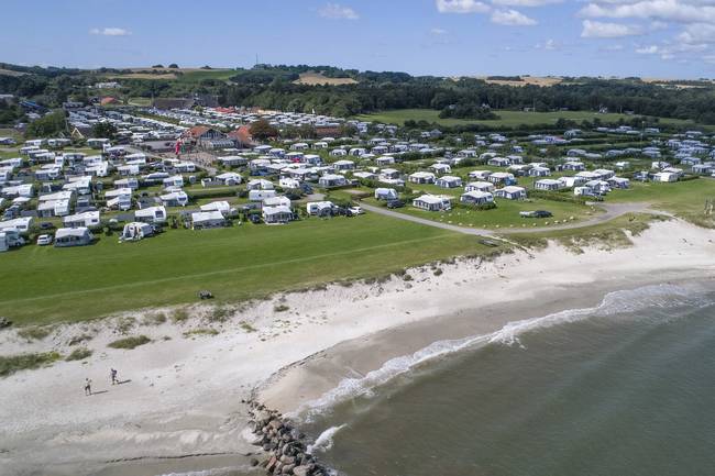 A stroll along the beach from cozy Sæby with the beautiful old houses, shops and cafes.
