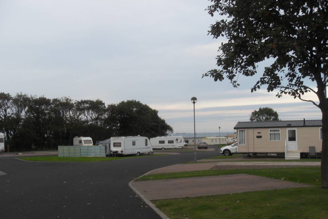 How far from the beach is Sandhaven Caravan and Camping Park?