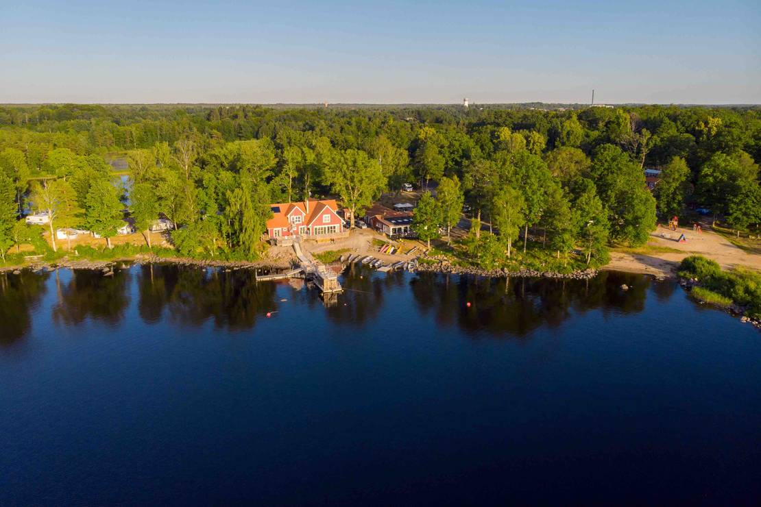 How far from the lake is First Camp Sjöstugan - Älmhult?